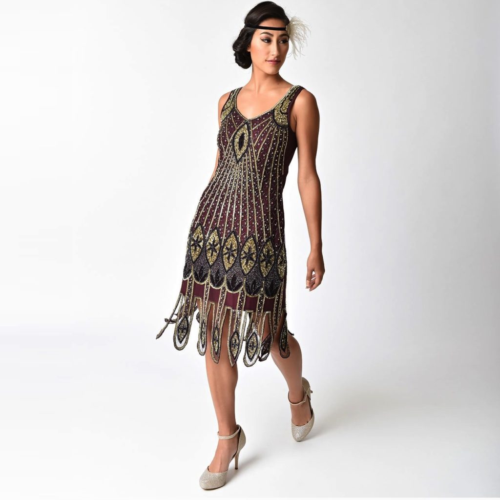 maroon and golden colour gown