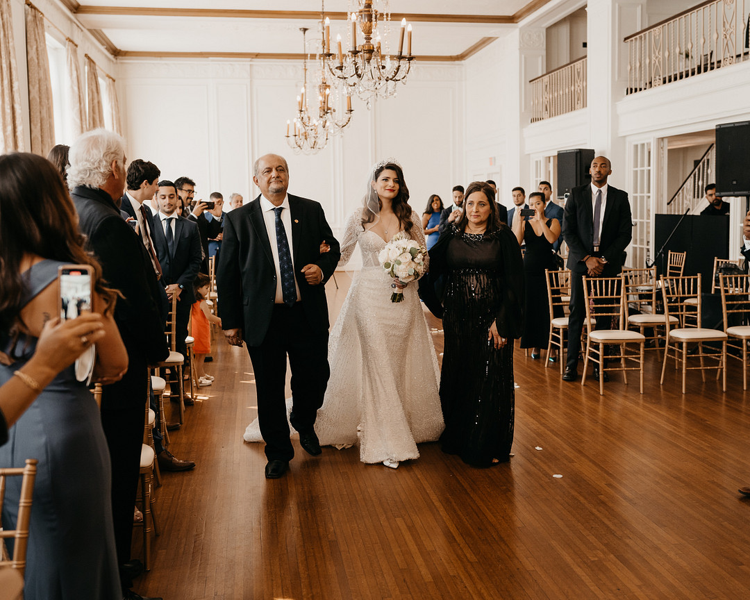 Parents Walking Down the Aisle | Elegant Hotel Wedding
